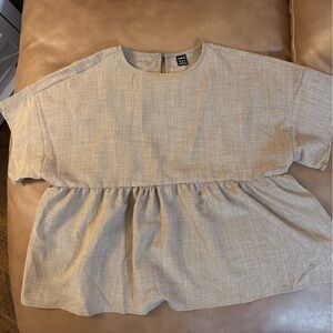 3 women’s sleeveless summer tops. Khaki, cream, and blue